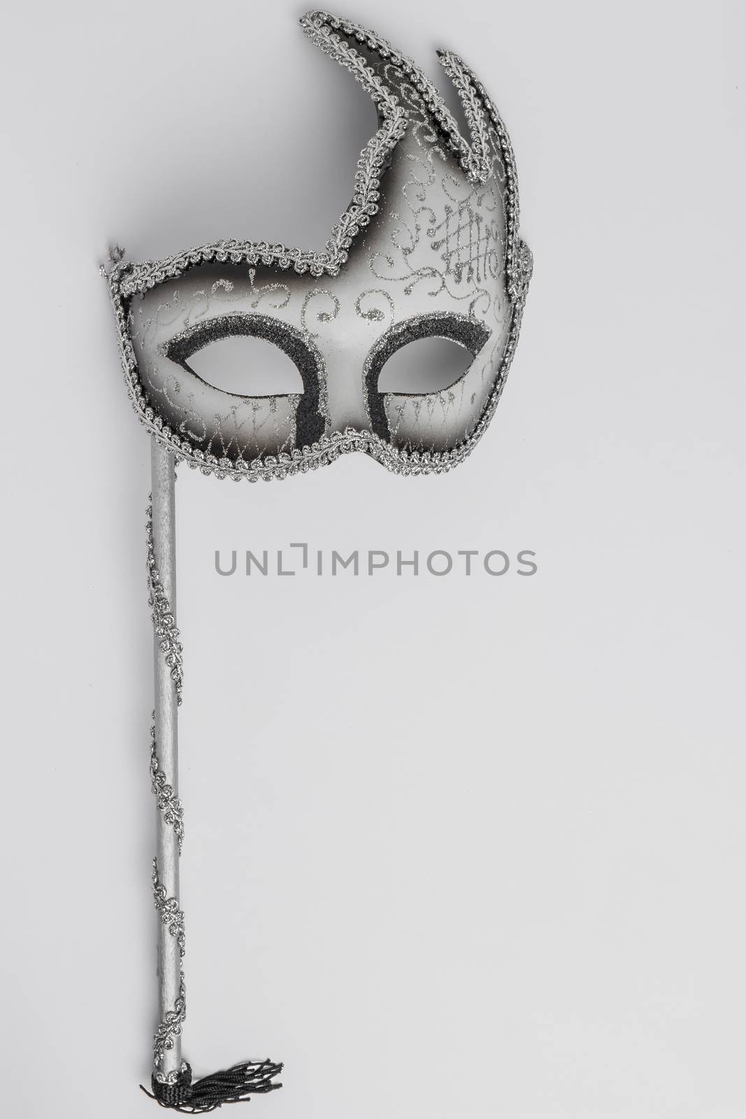 Colorful carnival mask on a white background. Top view with copy space