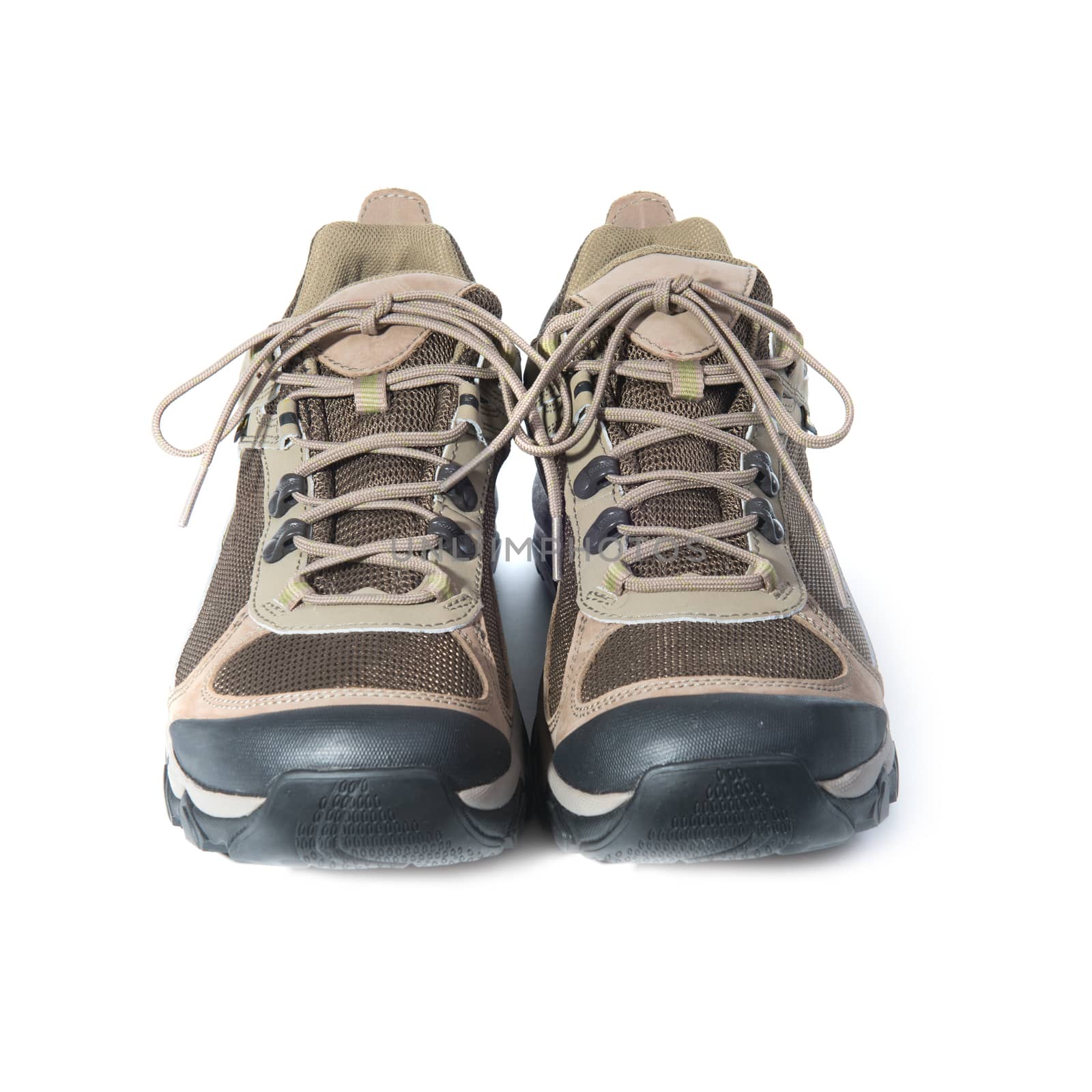 Pair of brown trainers on white isolated background