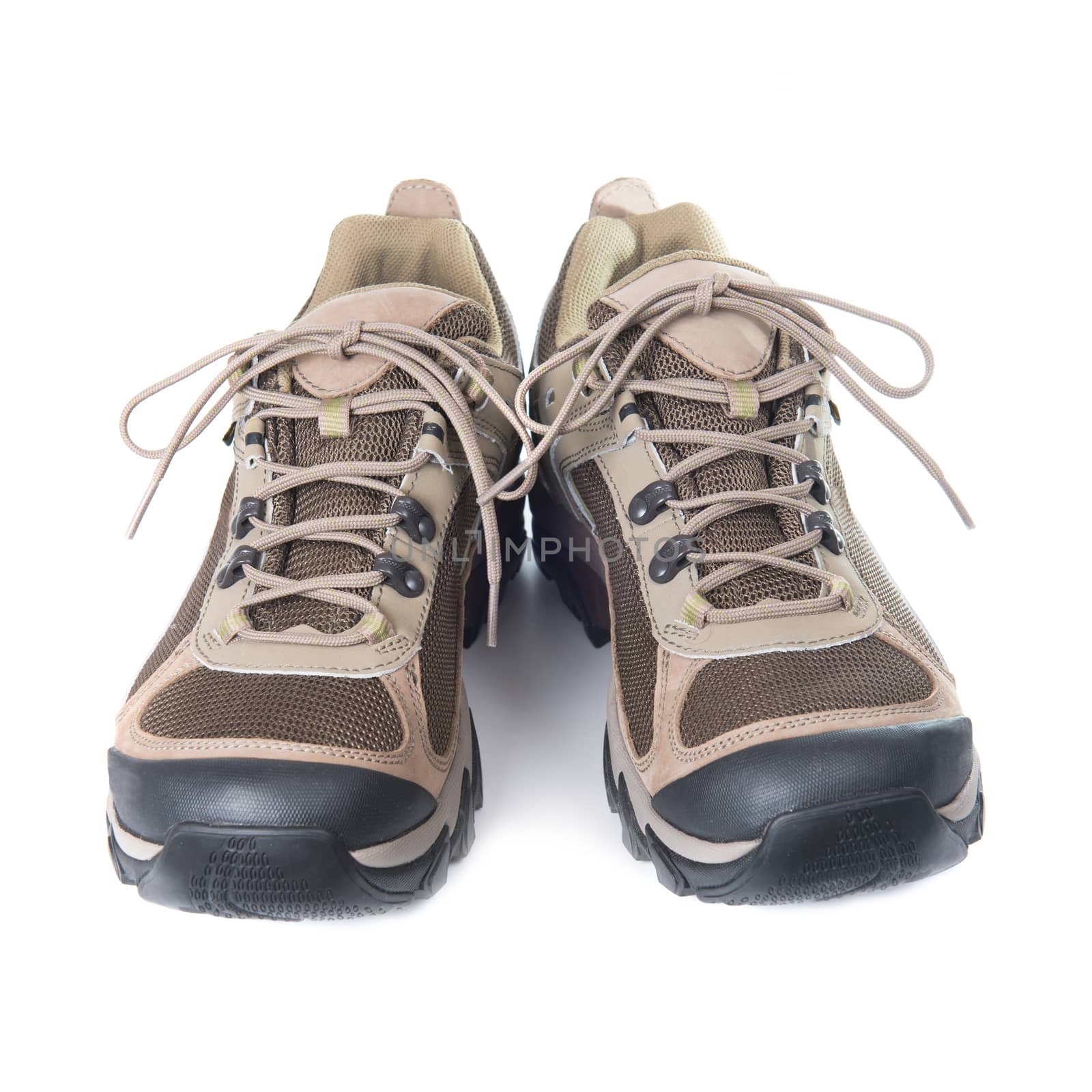 Pair of brown trainers on white isolated background