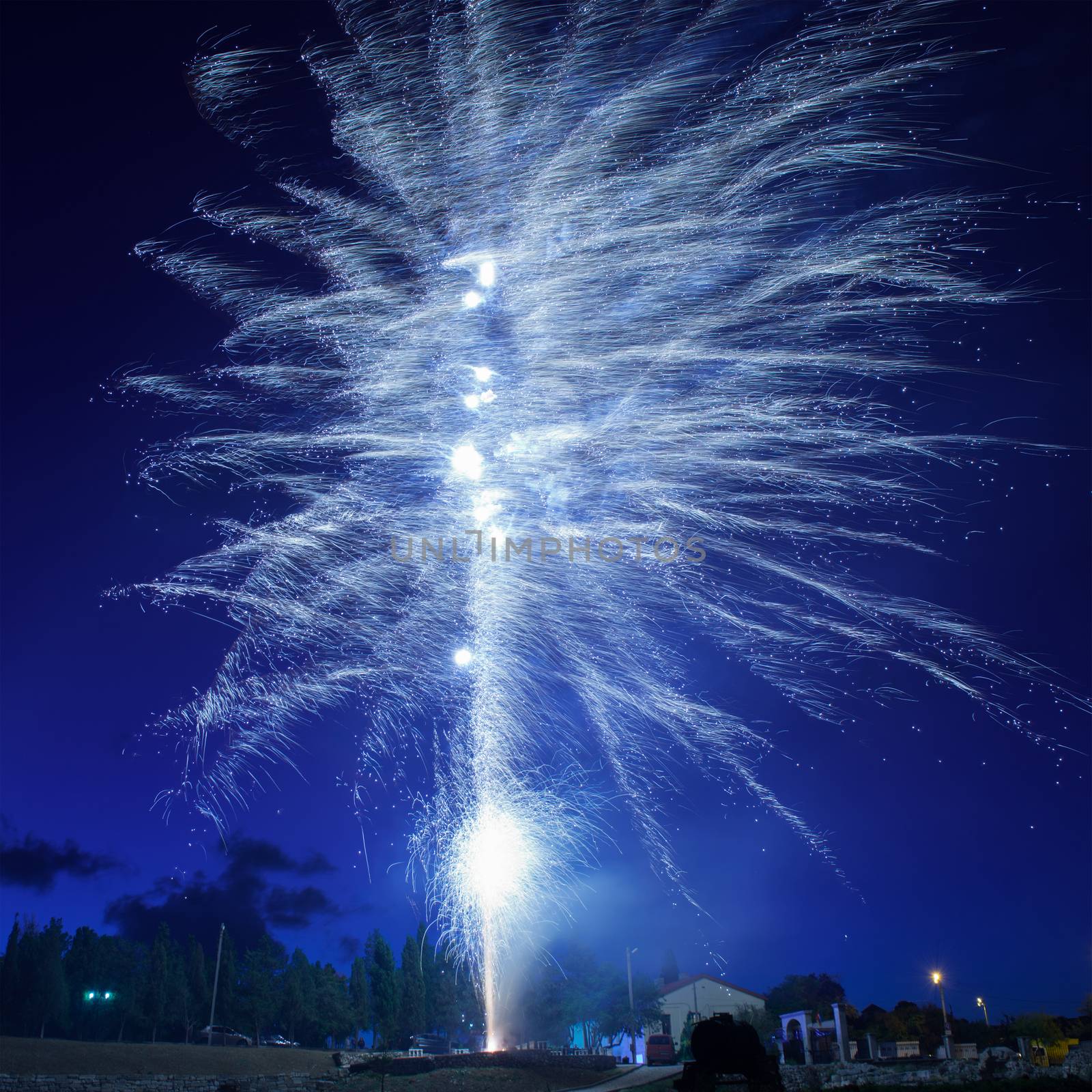 Blue colorful fireworks on night sky background