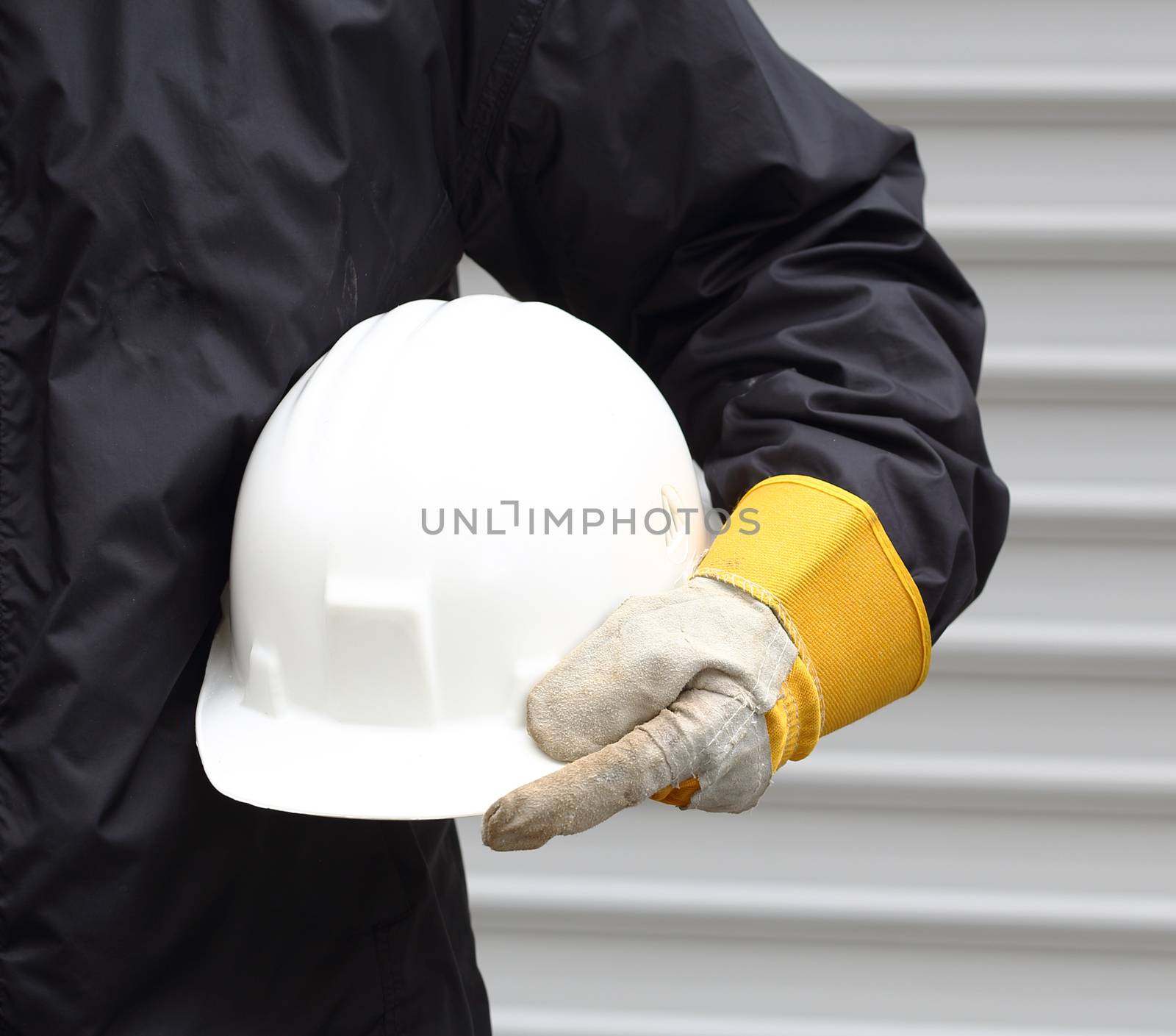 Man holding white helmet close up