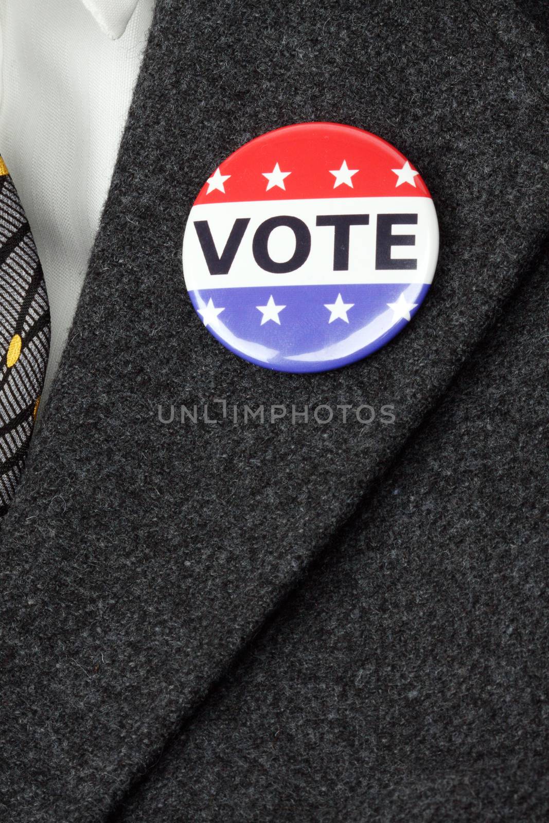 man with Vote button  pinned on his  suit