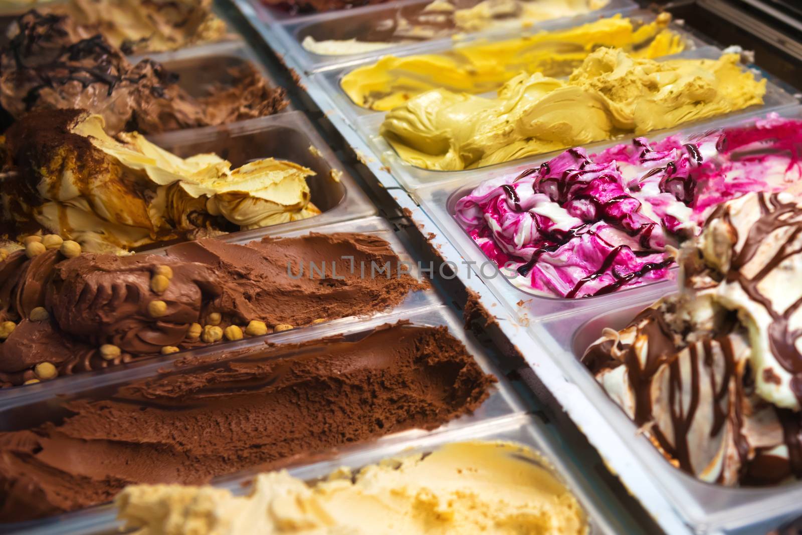 Many boxes of ice cream gelato in a shop