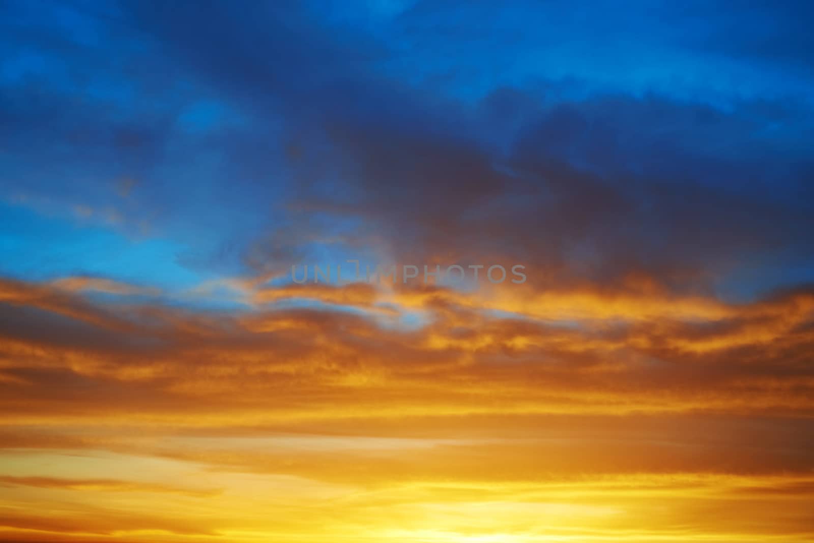 Dramatic sky at sunset with red, yellow, orange and blue colors