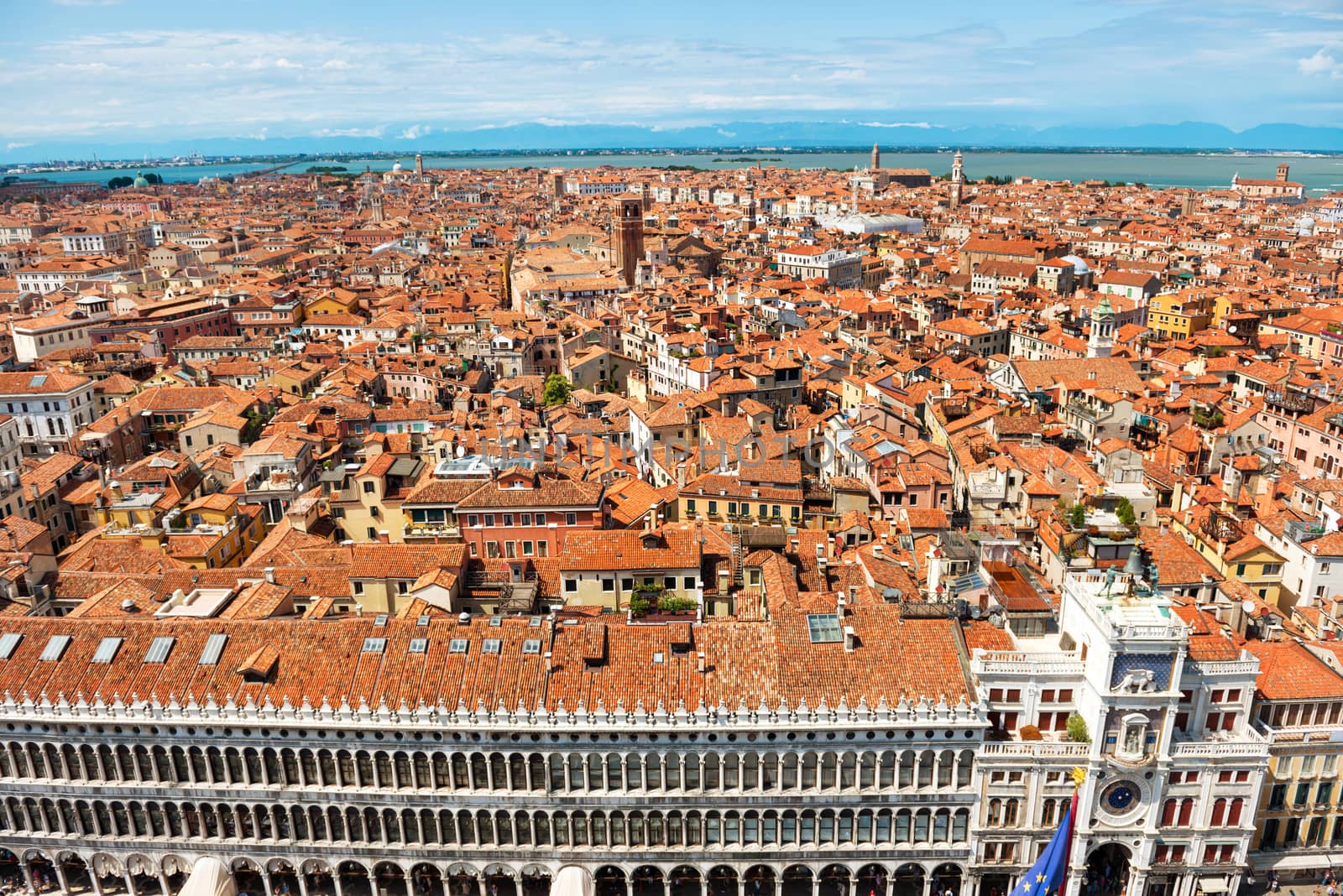 Venice roofs from above. Aerial view of houses, sea and palaces from San Marco tower