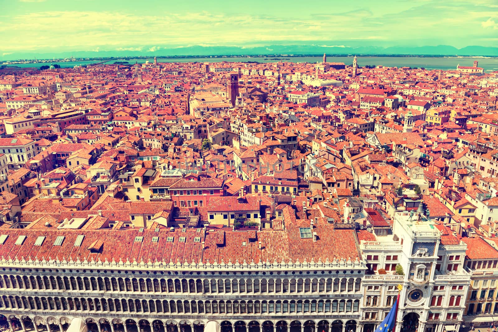 Venice roofs from above. Aerial view of houses, sea and palaces from San Marco tower. Instagram like filter