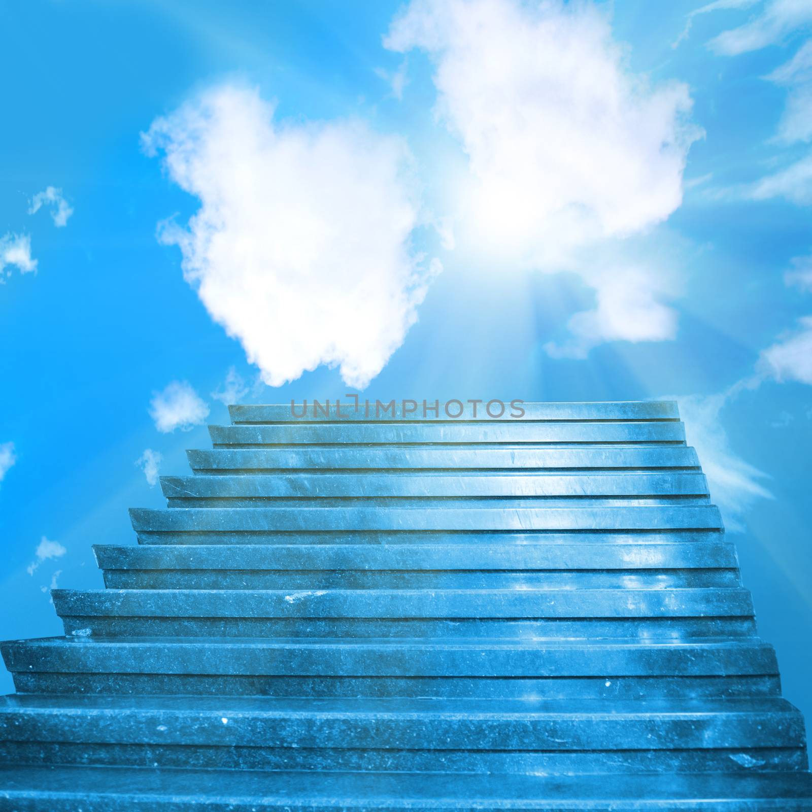 Stairway to heaven. Stairs towards sun on the blue sky with clouds