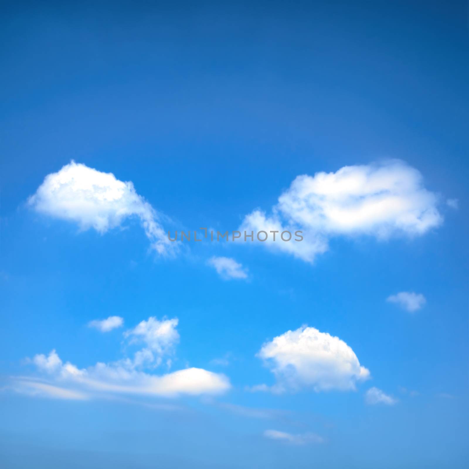 Beautiful blue sky with sunbeams and clouds. Sun rays.