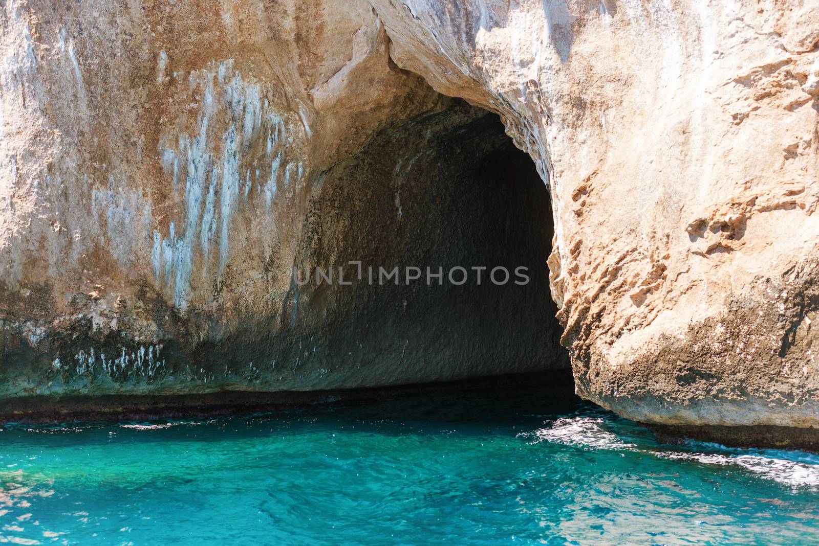 Big sea cave in the mediterranean coast by vapi