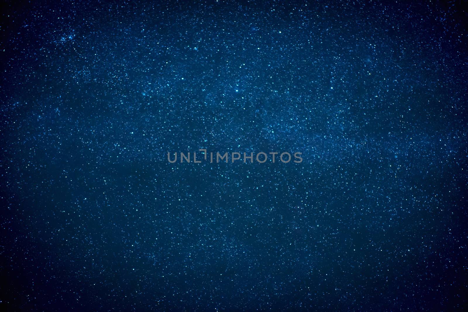 Blue dark night sky with many stars. Milky way on the space background