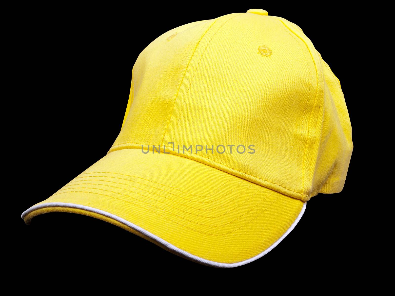 yellow baseball cap on black background, studio shot    