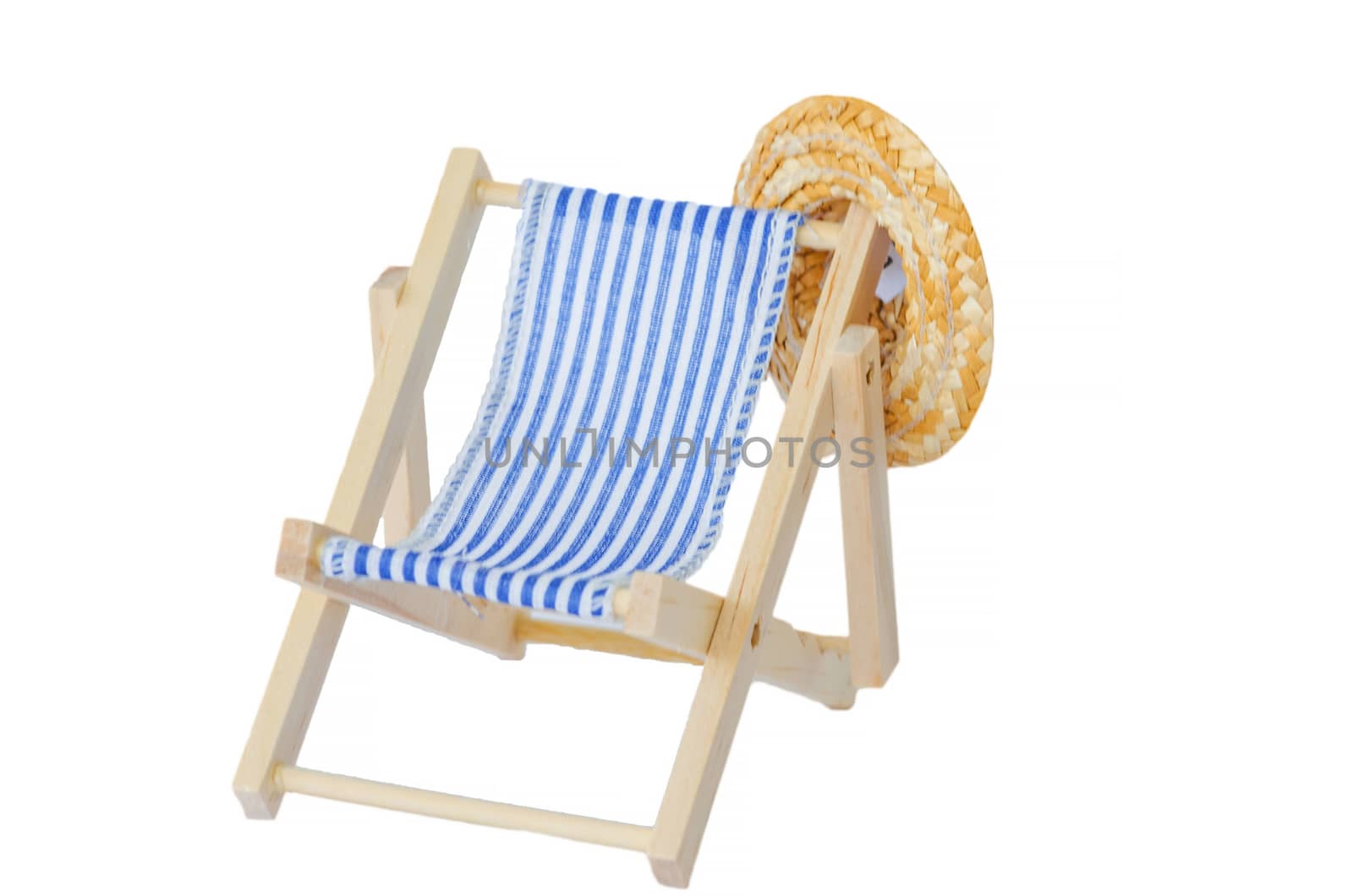Wooden deck chair with sun hat on a white background.