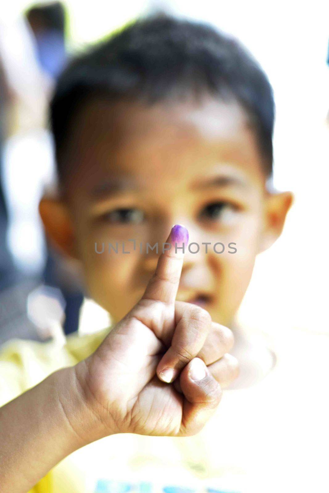 INDONESIA, Jakarta: A child shows off his tainted finger after having received Polio immunization in Ciracas, East Jakarta on March 10, 2016 during  National Polio Immunization Week. Indonesian Health Minister Nila Moeloek announced on March 8, 2016 plans to vaccinate 23.7 million babies — from birth to 59 months of age — to keep the world on track toward being polio-free by 2020.