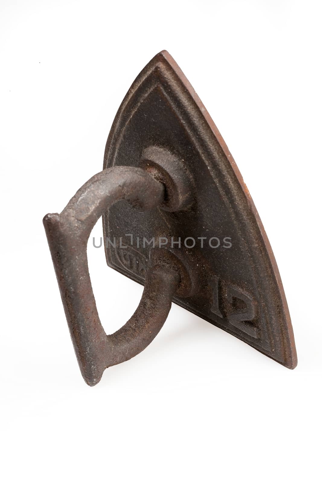 Old metal iron on isolated studio white background