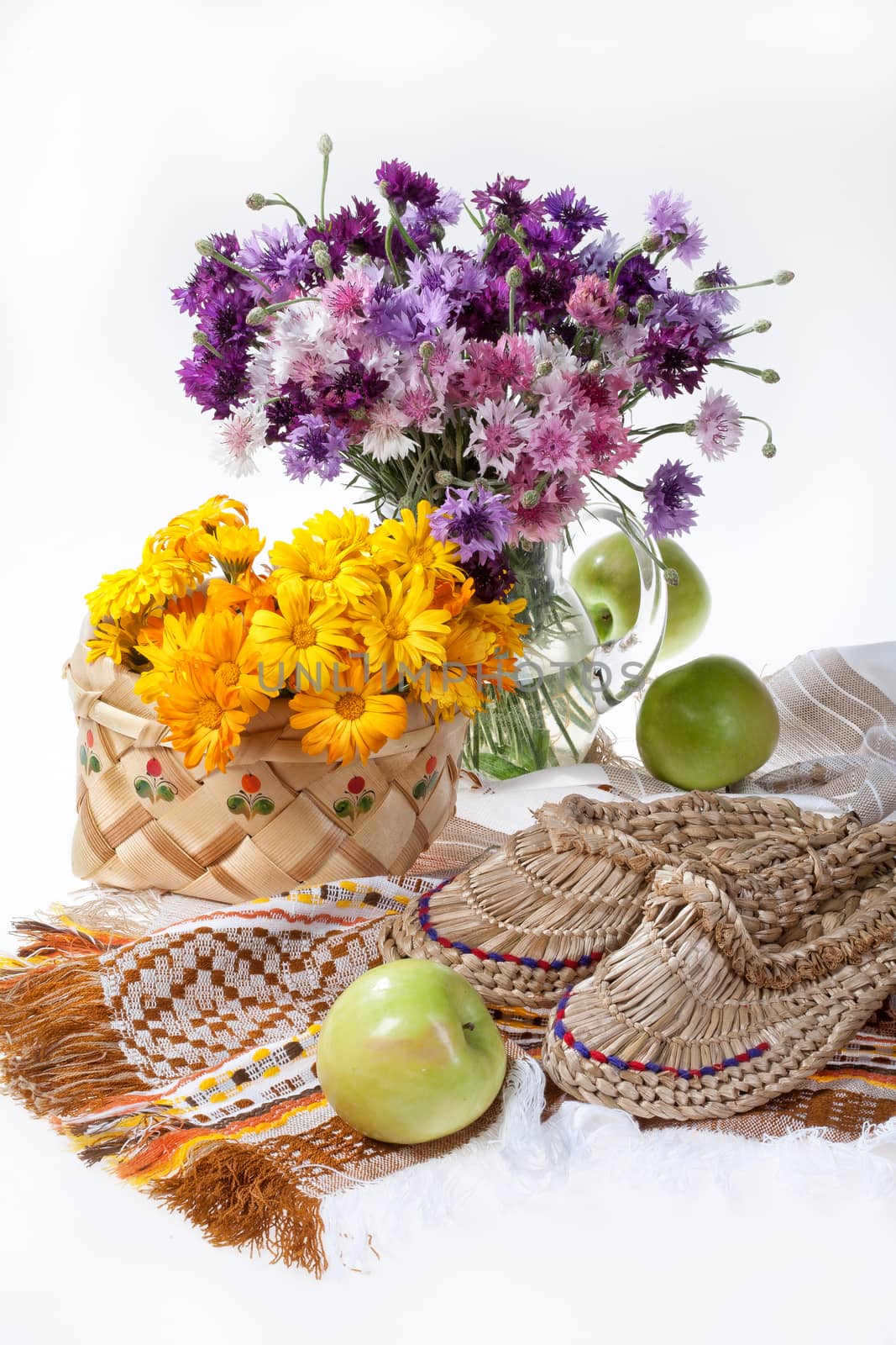 Flowers and Russian national artworks on an isolated studio background