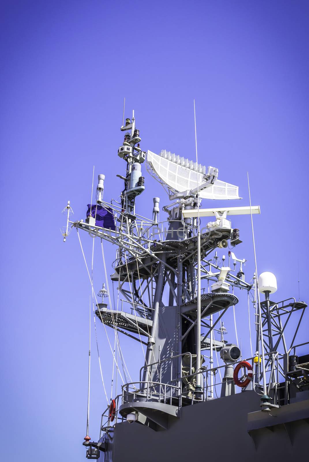 Radar on battleship with blue sky background