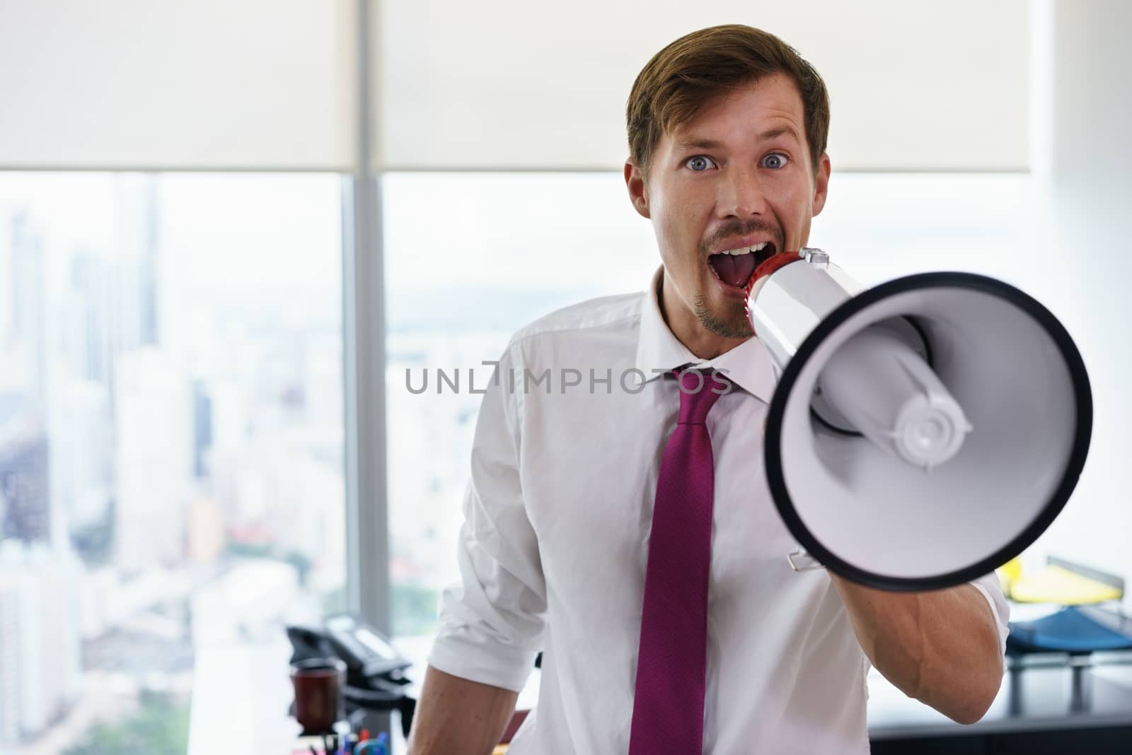 White Collar Worker With Megaphone Fighting For Labor Rights-2 by diego_cervo