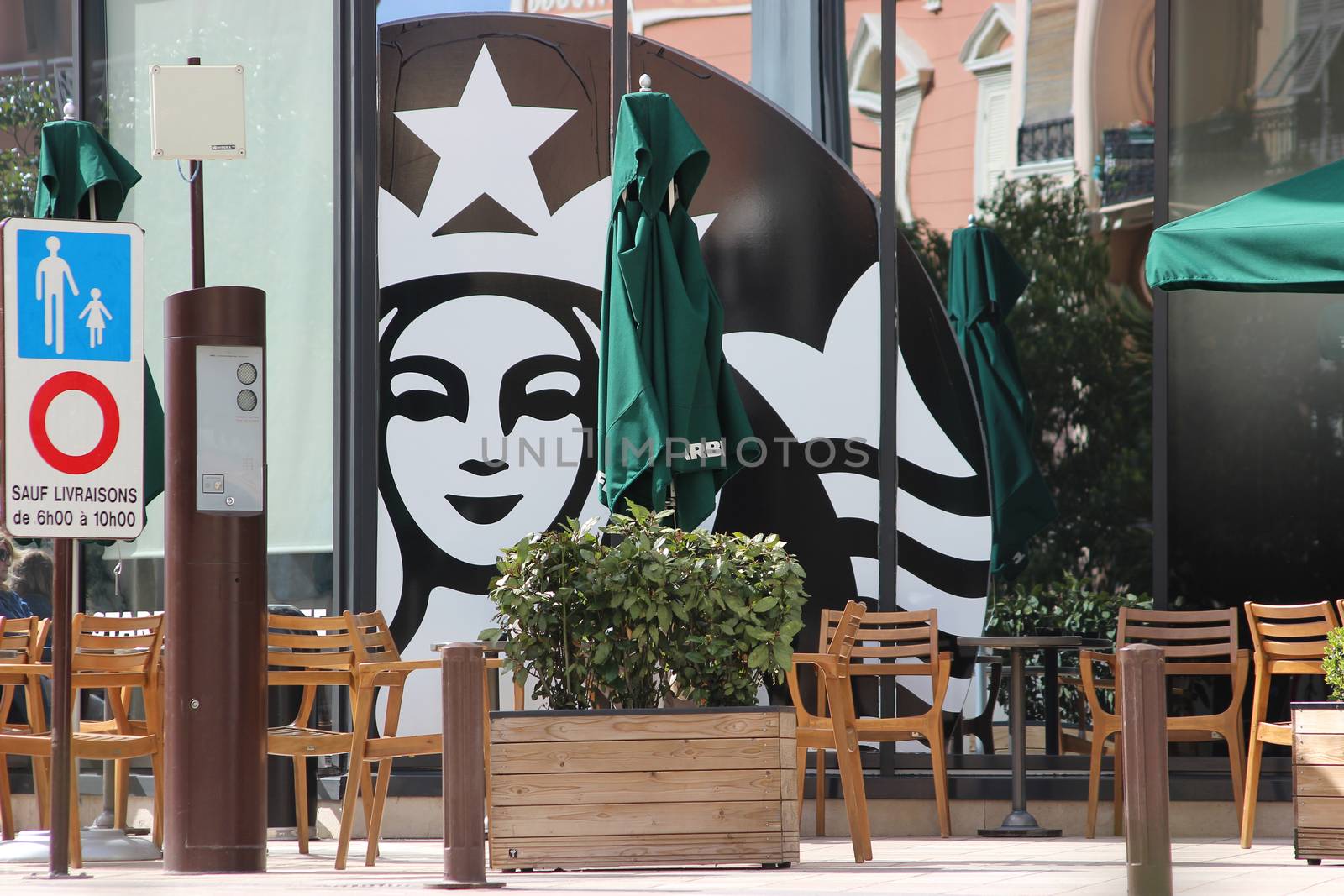 Monte-Carlo, Monaco - March 9, 2016: Starbucks Sign is Displayed at the Facade of a Starbucks Store. Starbucks Corporation is an American Coffee Company and the Largest Coffeehouse Company in the world with 23,450 Stores in 67 Countries