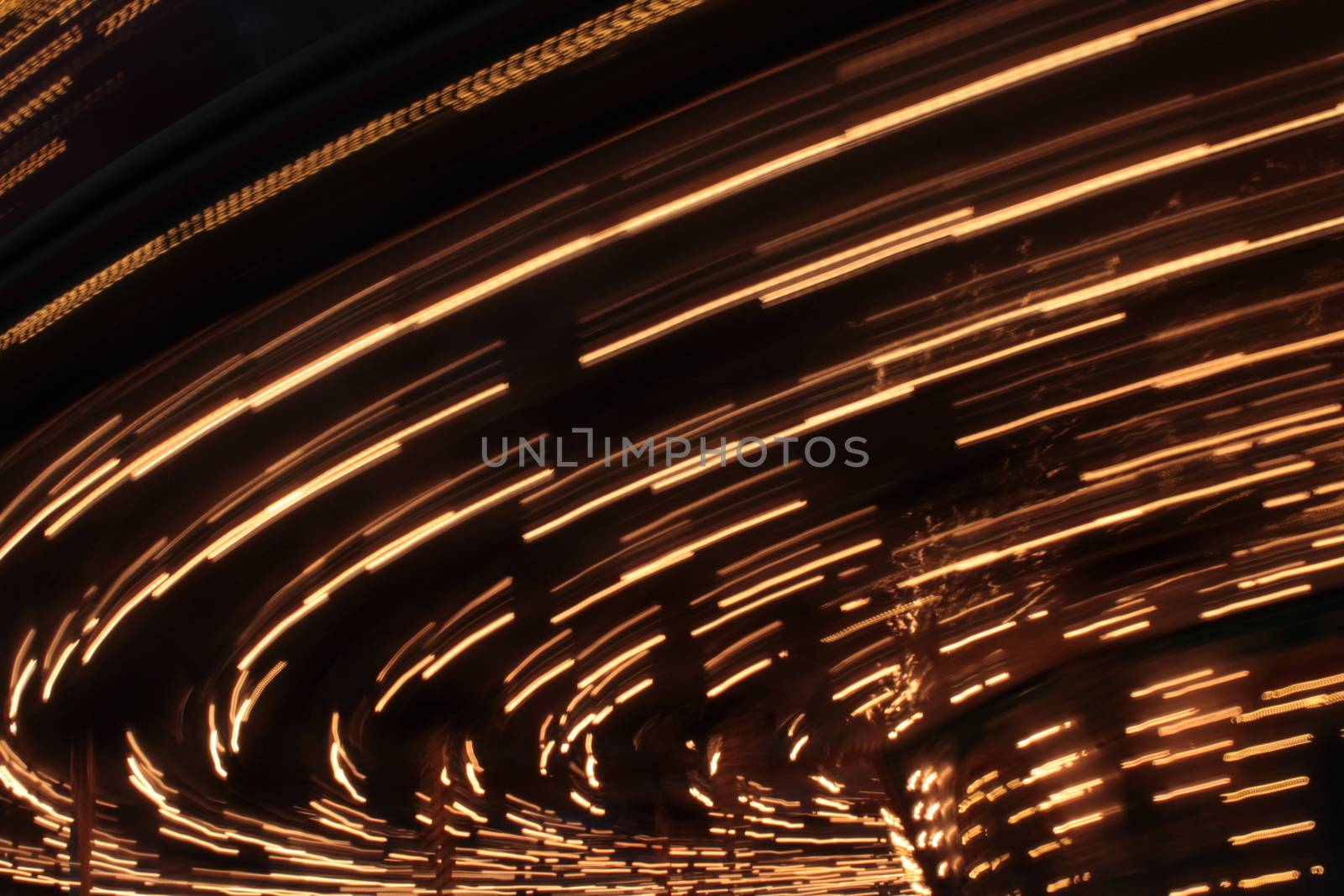 Night colors of the amusement park lights moving, light trails, slow shutter-speed