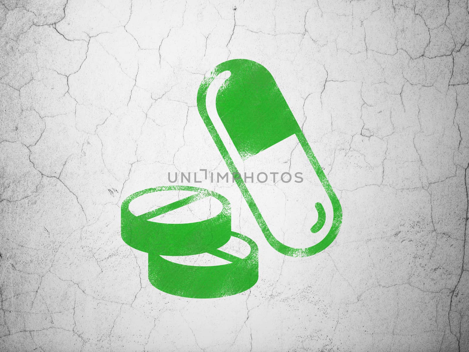 Health concept: Green Pills on textured concrete wall background