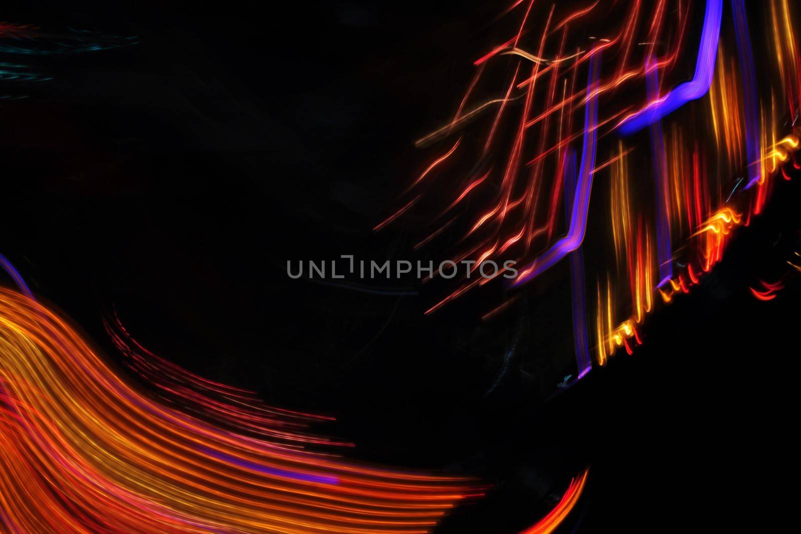 Night colors of the amusement park lights moving, light trails, slow shutter-speed