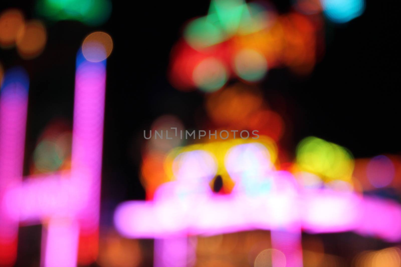 Night colors of the amusement park lights moving, light trails, slow shutter-speed