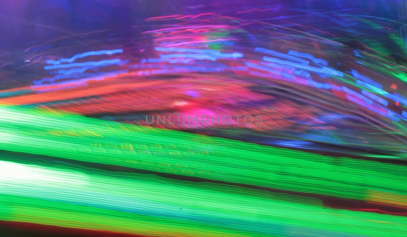 Night colors of the amusement park lights moving, light trails, slow shutter-speed