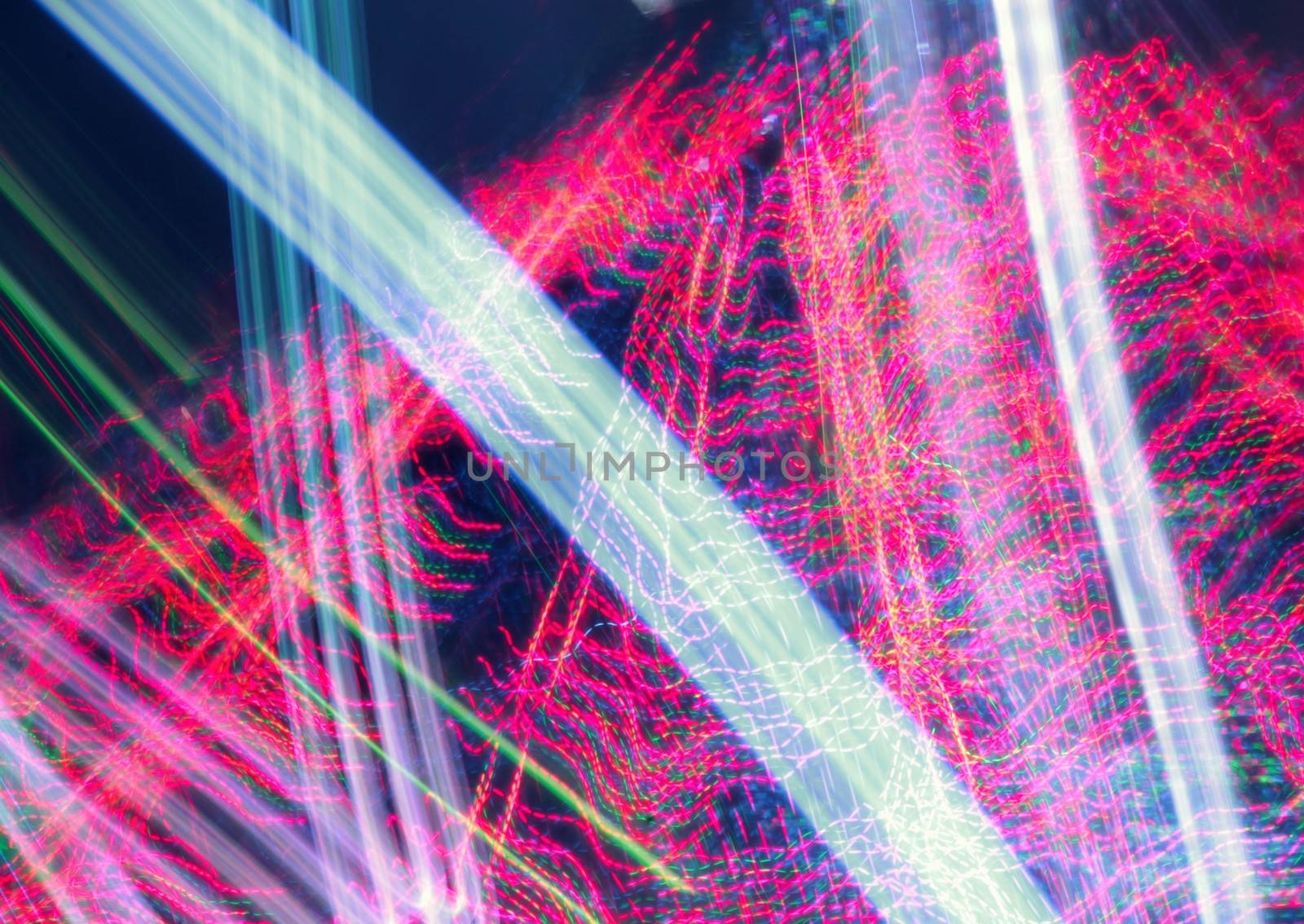 Night colors of the amusement park lights moving, light trails, slow shutter-speed