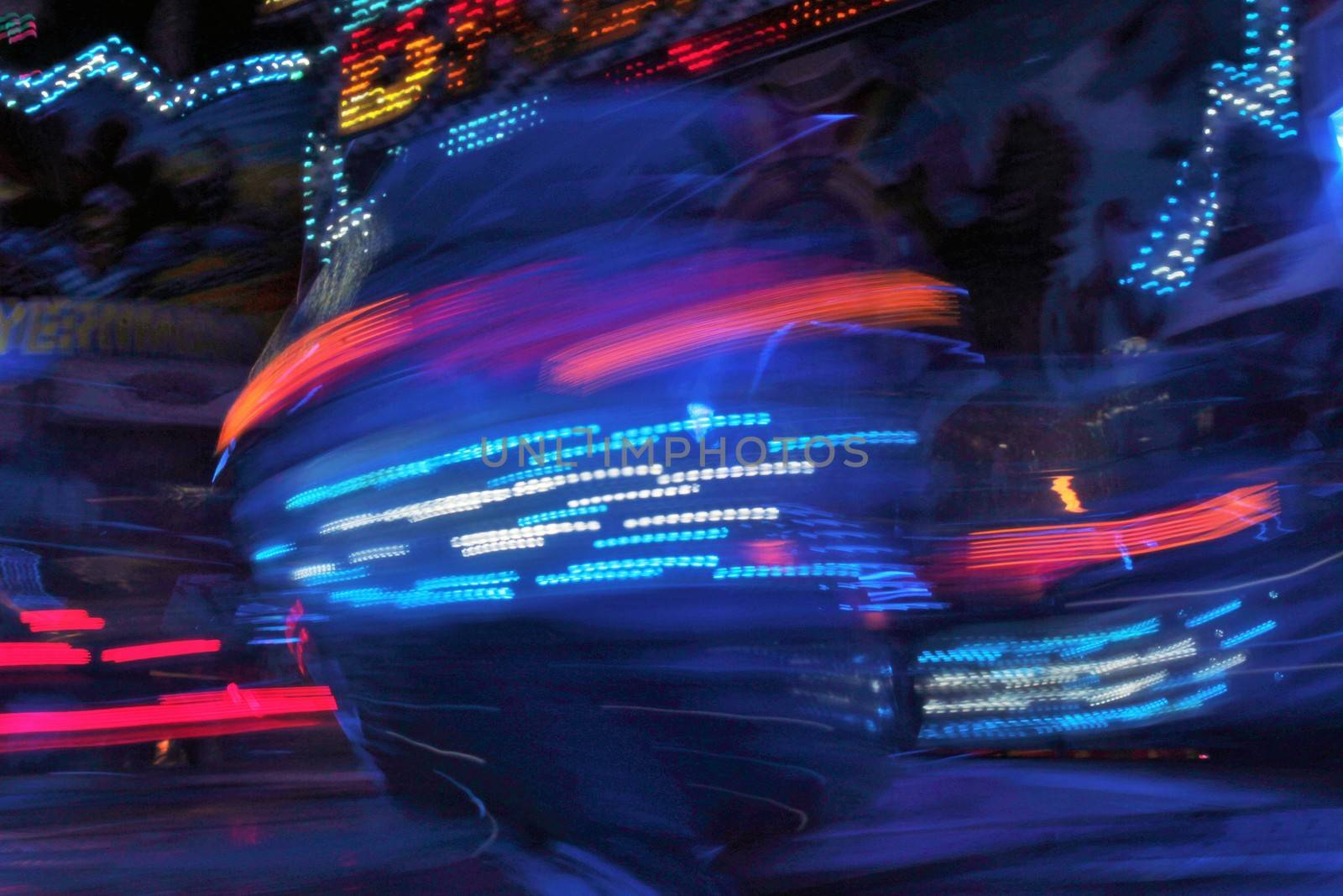 Night colors of the amusement park lights moving, light trails, slow shutter-speed