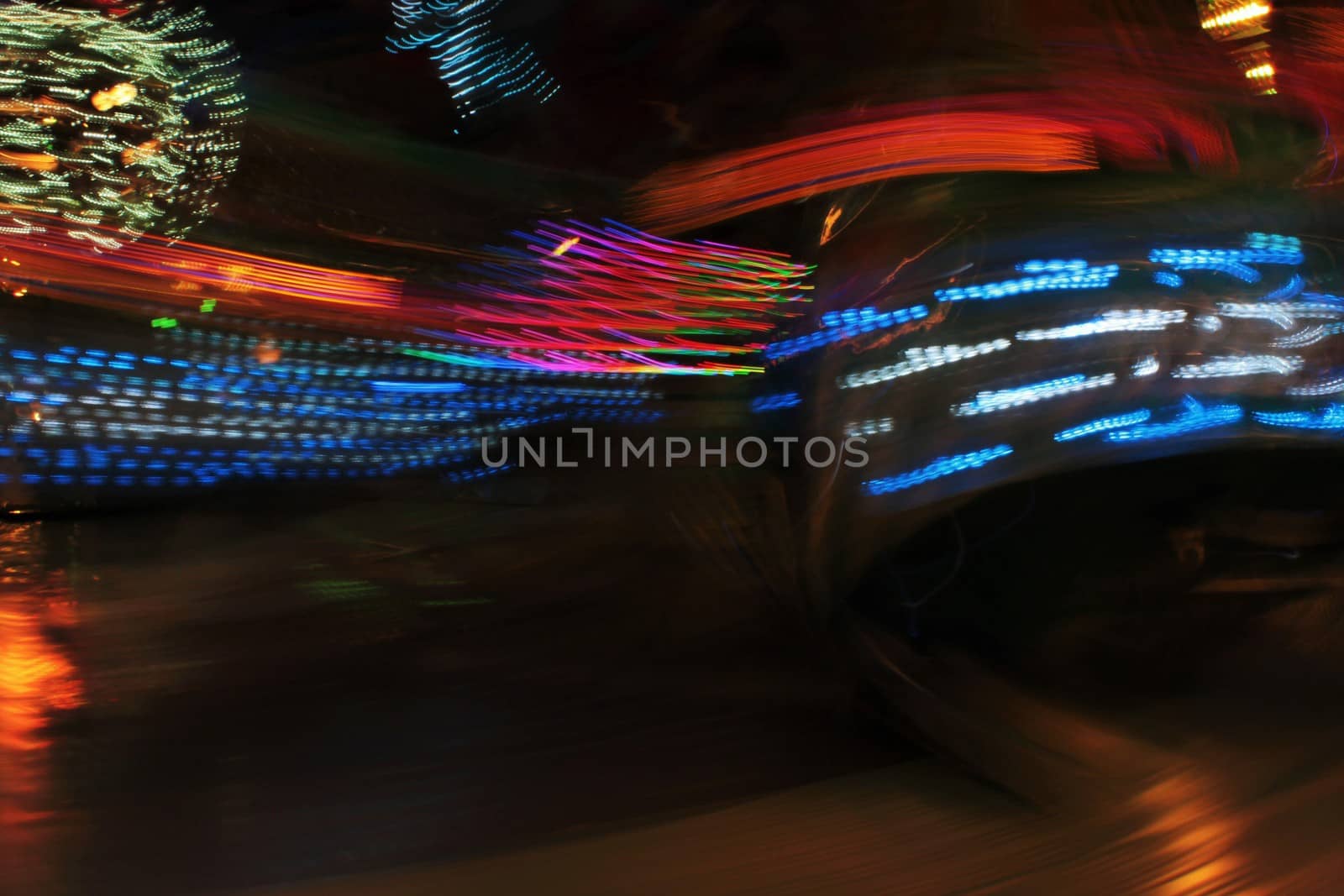 Night colors of the amusement park lights moving, light trails, slow shutter-speed