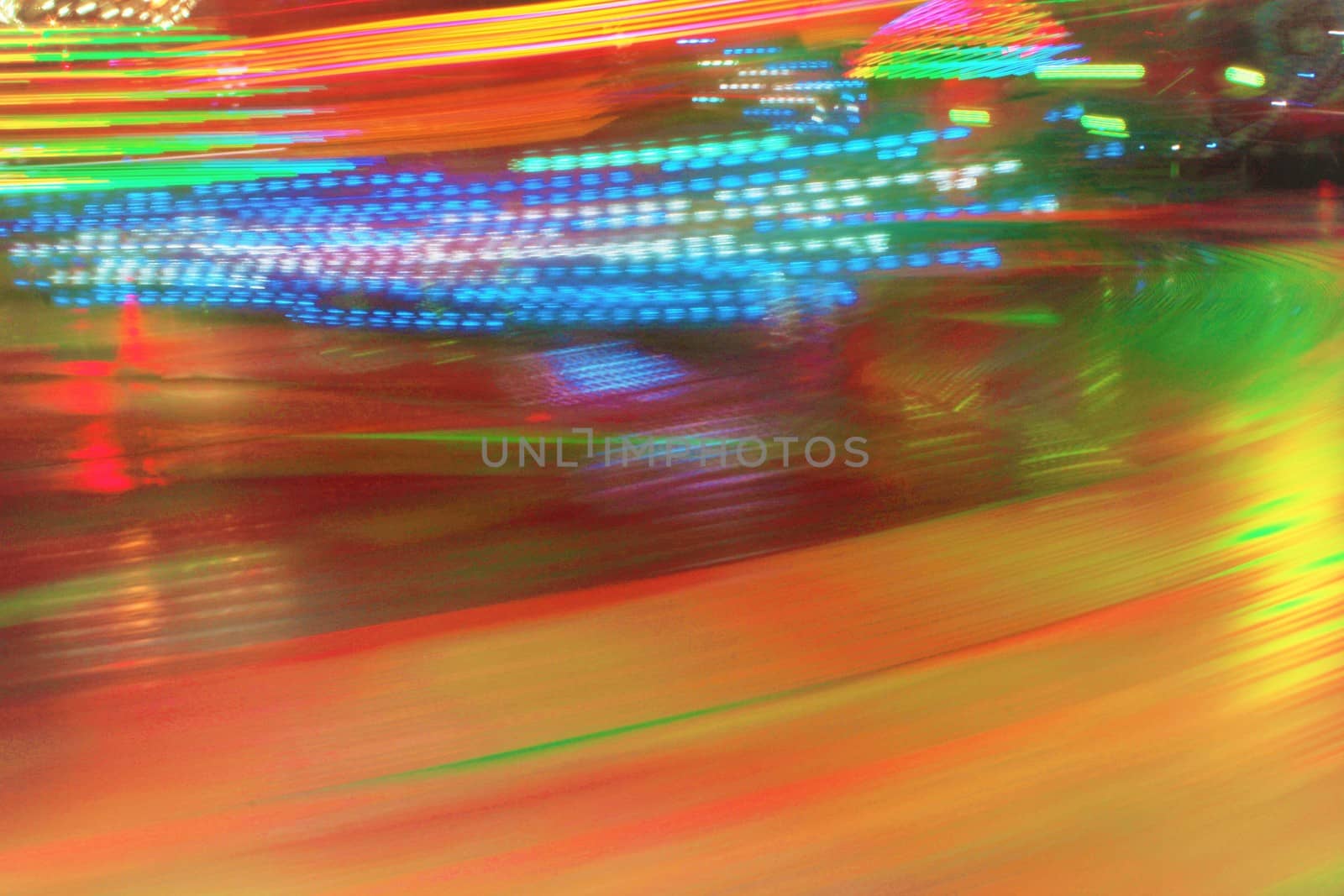 Night colors of the amusement park lights moving, light trails, slow shutter-speed