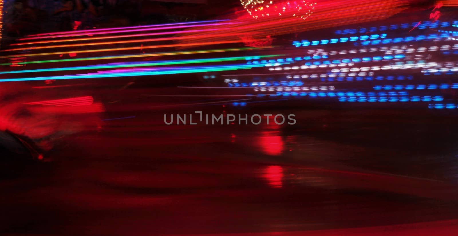 Night colors of the amusement park lights moving, light trails, slow shutter-speed