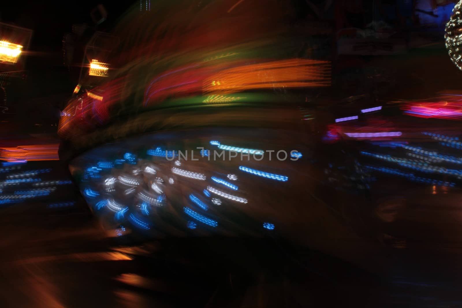 Night colors of the amusement park lights moving, light trails, slow shutter-speed