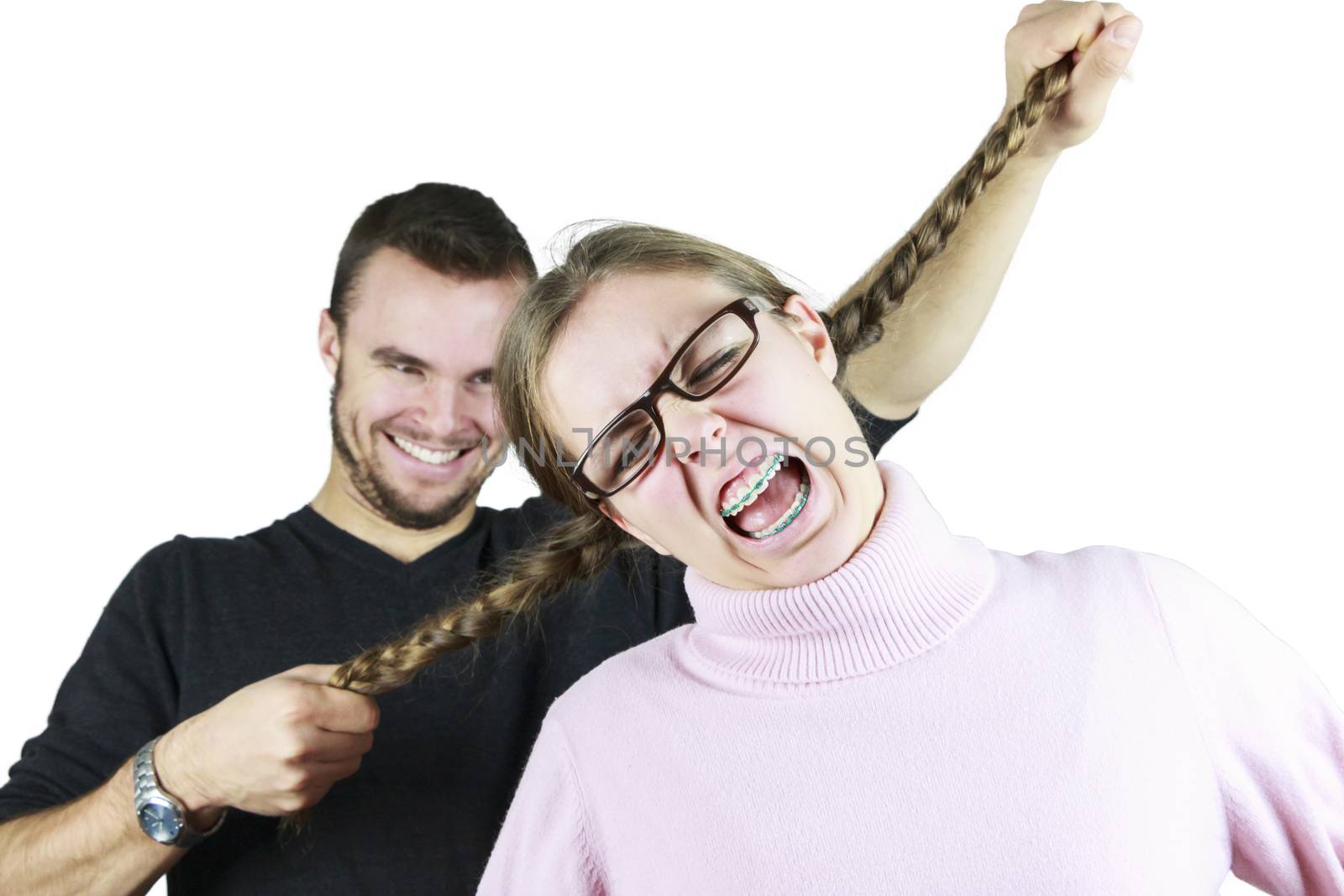 Young Man Pulling Girls Pony-tails