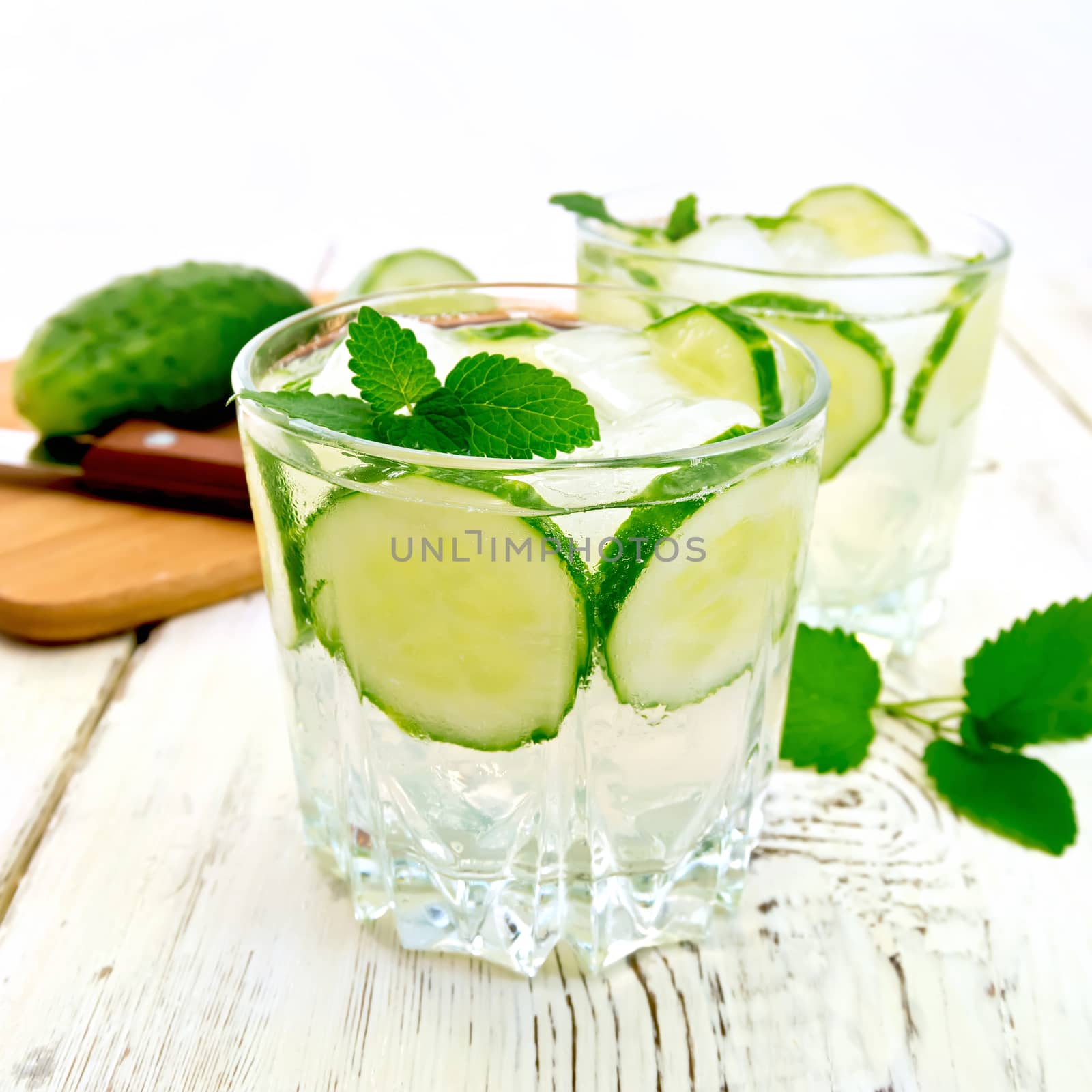 Lemonade with cucumber and mint in two glassful on board by rezkrr