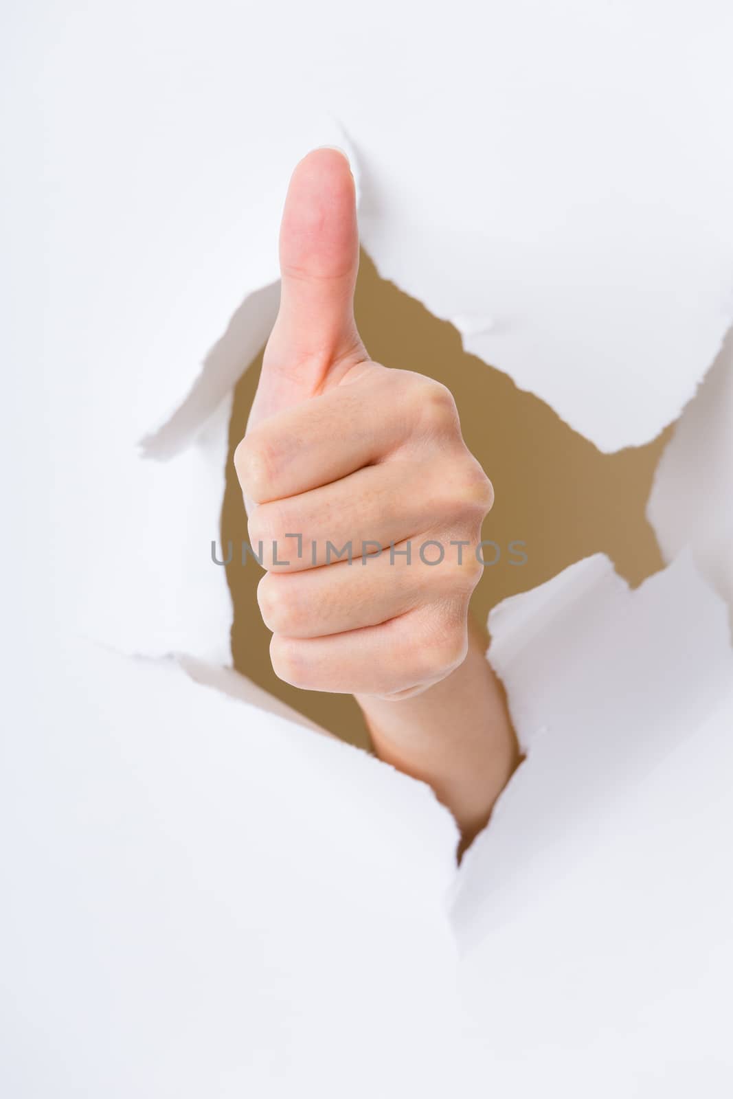 Human hand gesturing thumbs up