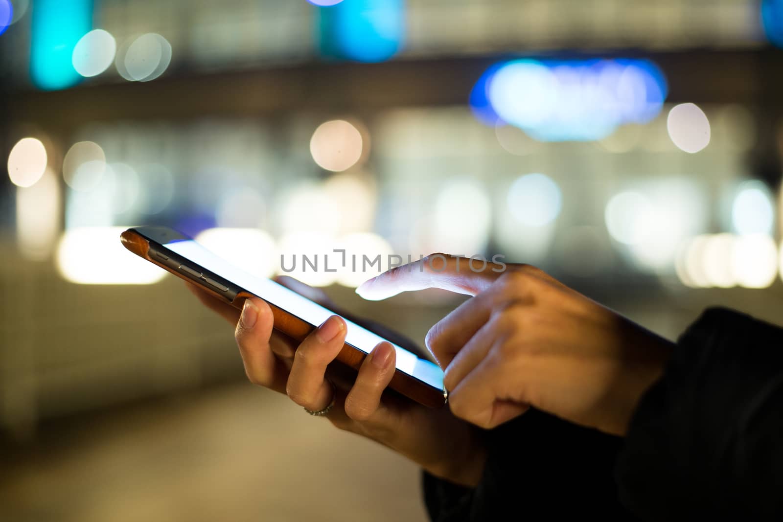 Woman finger touch on blank screen of cellphone by leungchopan