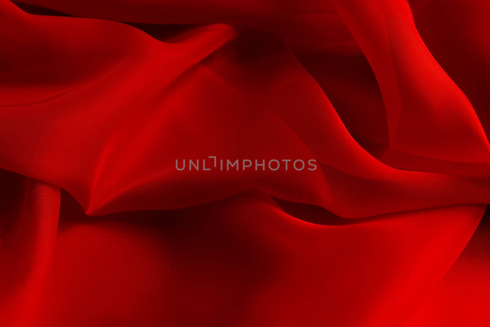 the texture of the red fabric from the delicate chiffon