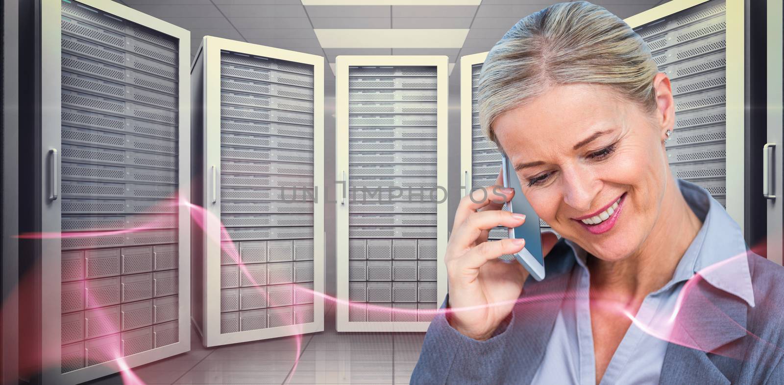 Composite image of smiling businesswoman using mobile phone by Wavebreakmedia