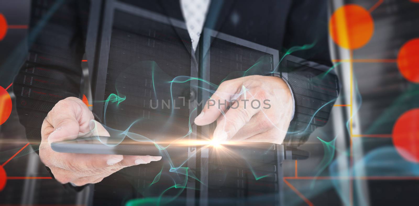  Close up view of businessman using tablet computer against abstract glowing black background