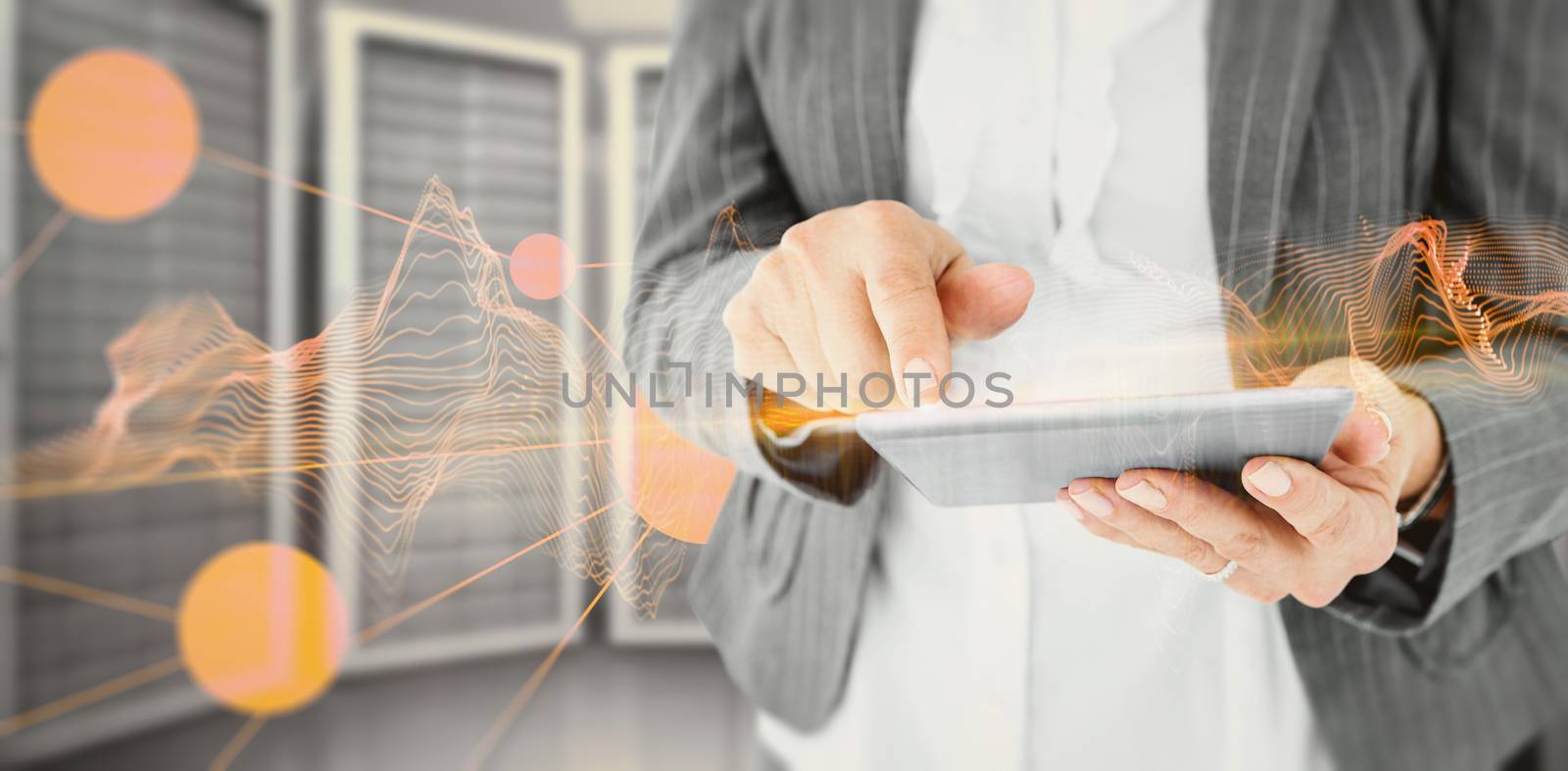 Composite image of  businesswoman using her tablet by Wavebreakmedia