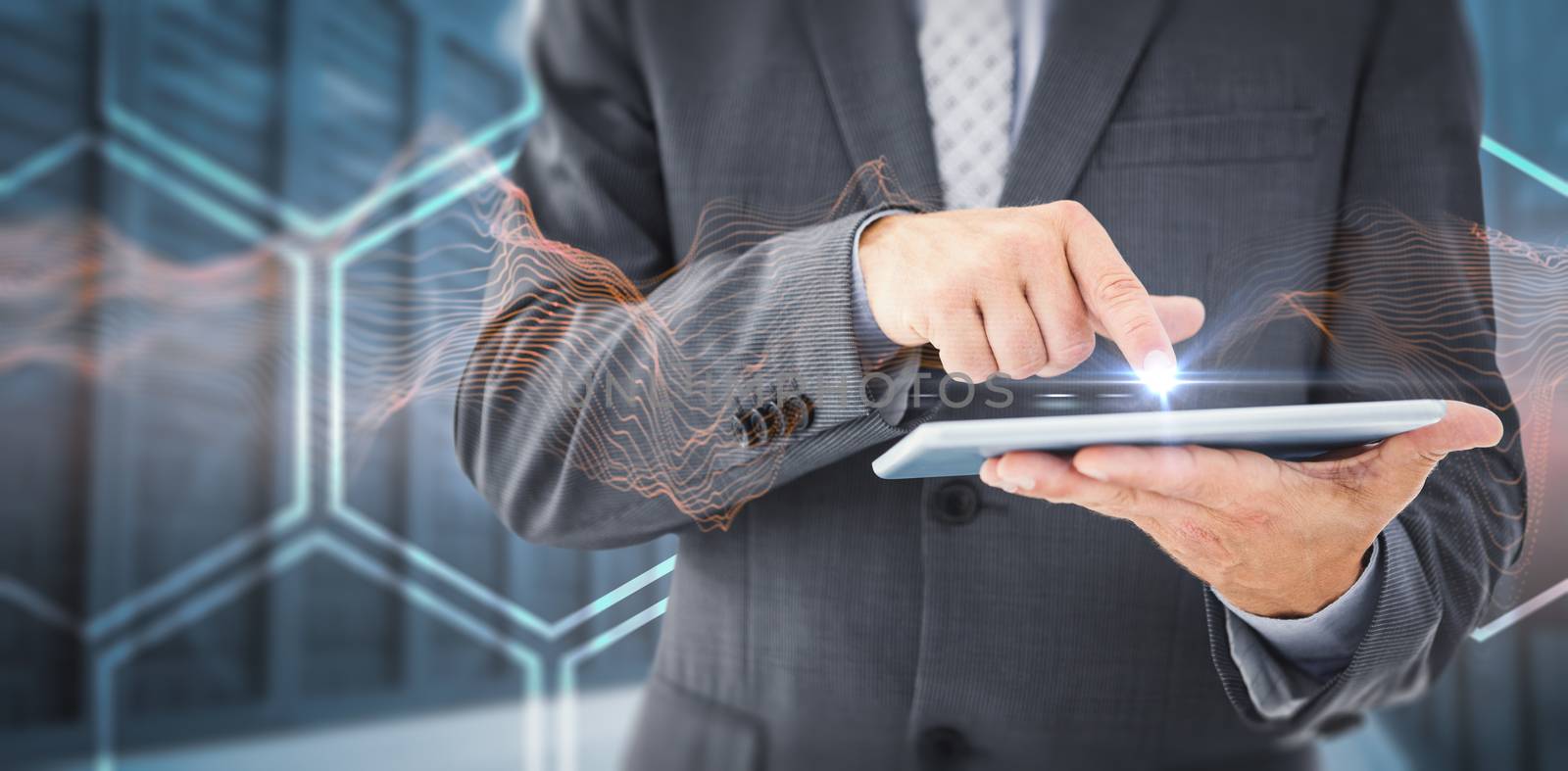 Composite image of businessman using tablet pc by Wavebreakmedia