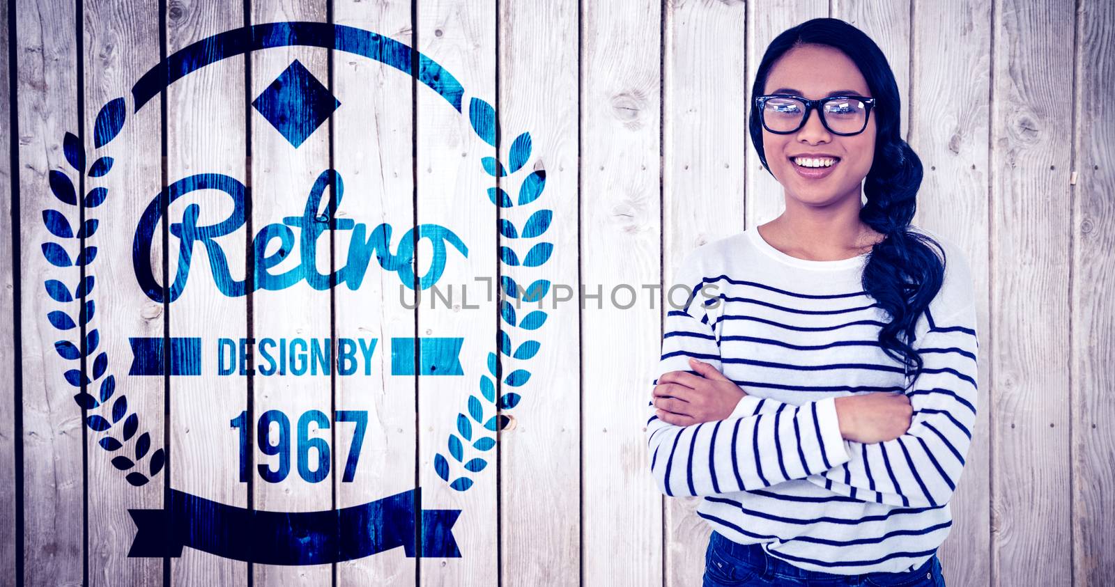 Composite image of smiling asian woman with arms crossed looking at the camera by Wavebreakmedia