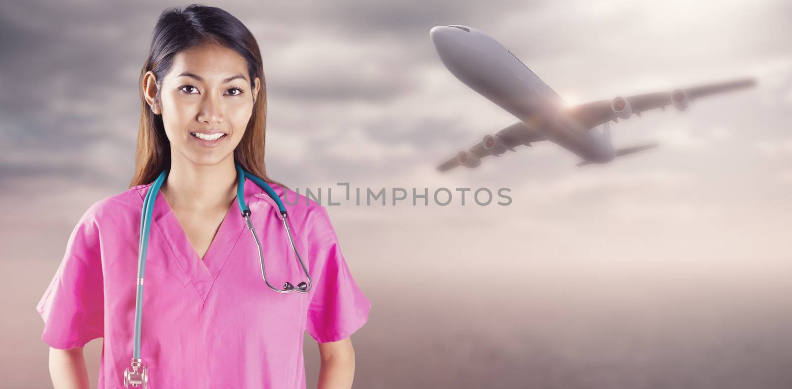 Asian nurse with stethoscope looking at the camera against desert landscape