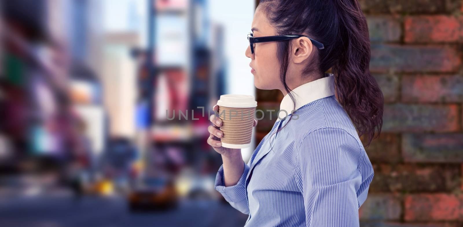 Composite image of businesswoman holding disposable cup and looking at wall with notes by Wavebreakmedia