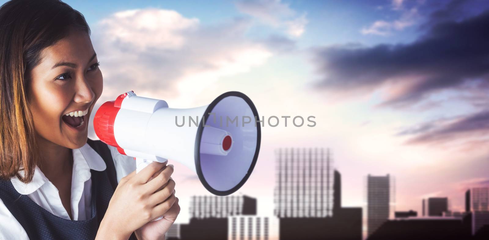 Composite image of businesswoman shooting through a megaphone by Wavebreakmedia