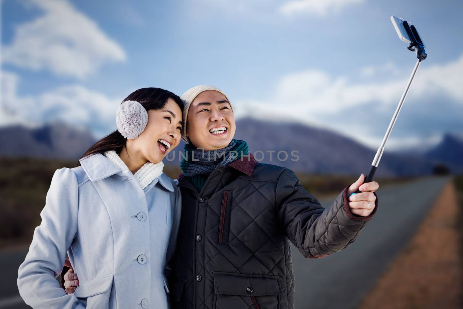Composite image of couples taking funny pictures using smartphone by Wavebreakmedia