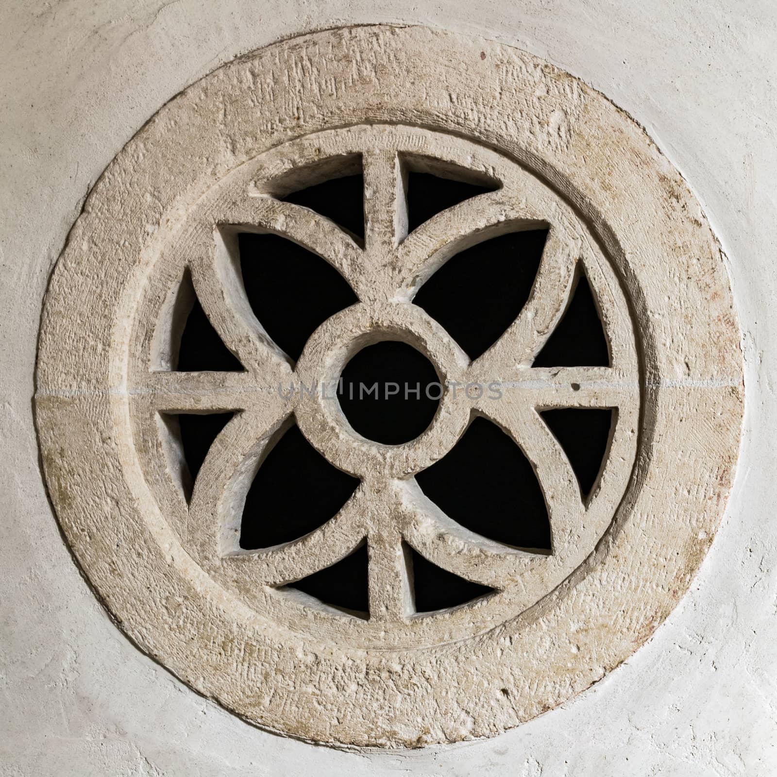 Round stone window within a symmetrical design. by Isaac74