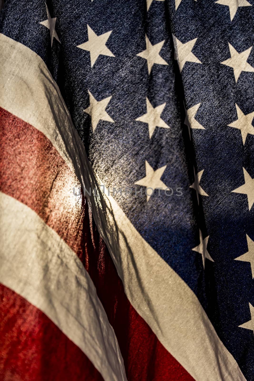 Closeup of grunge American flag with the sun on the back