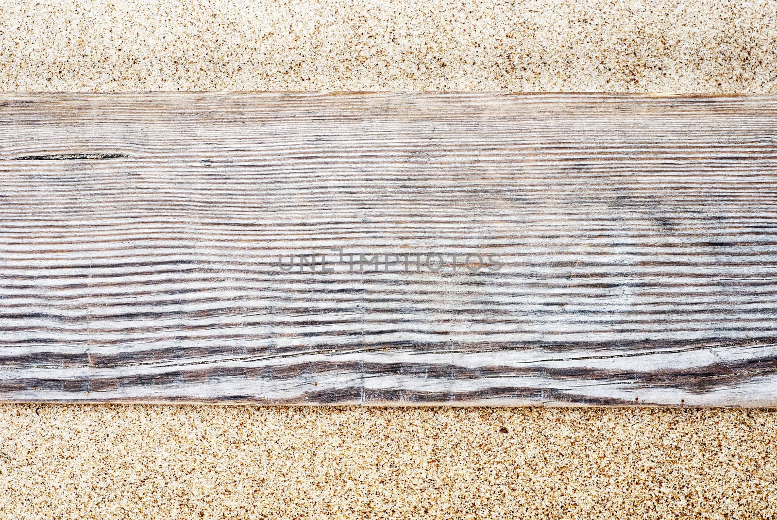 Wooden plank path on the sandy beach